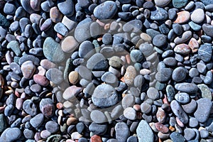 Medium-sized pebbles on the seaside Background