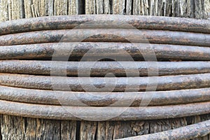 Medium sized wire wrapped around a wooden core as a background