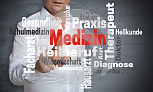 Medizin in german Medicine wordcloud touchscreen is operated b photo