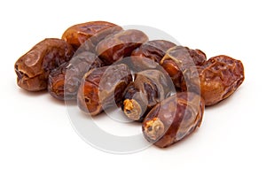 Medjool dates isolated on a white background.