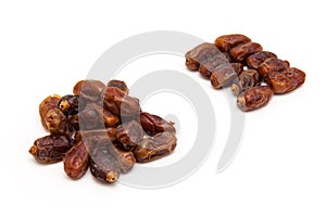 Medjool dates isolated on a white background.