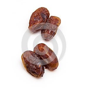 Medjool dates isolated on a white background.