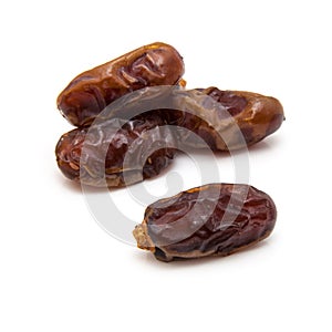 Medjool dates isolated on a white background.