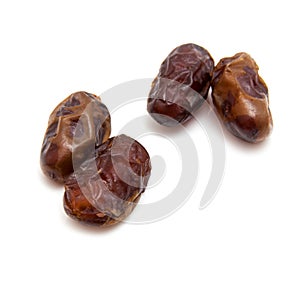 Medjool dates isolated on a white background.