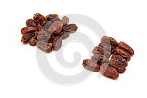 Medjool dates isolated on a white background.