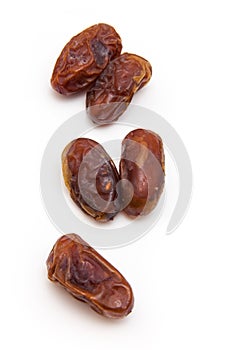 Medjool dates isolated on a white background.