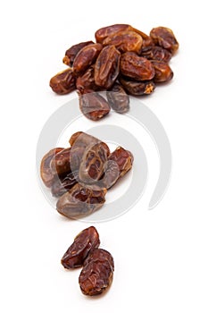 Medjool dates isolated on a white background.