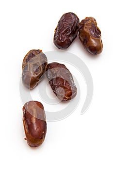 Medjool dates isolated on a white background.