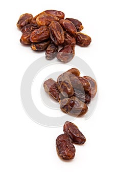 Medjool dates isolated on a white background.