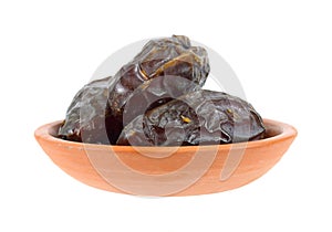 Medjool dates in terra cotta dish