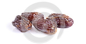 Medjool dried date palm fruits isolated on a white background