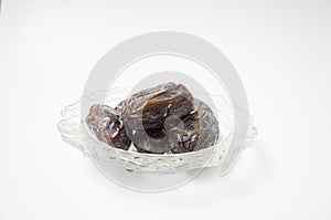 Medjoul or Medjool dates on white background