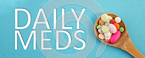 Daily meds text with spoon full of medicine
