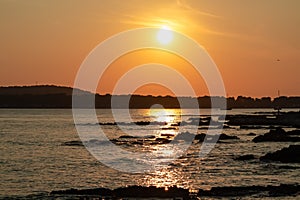 Medulin - Beautiful sunset at rocky beach in coastal town Medulin, Istria peninsula, Croatia, Europe. Romantic view