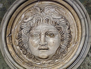 Medusa face sculpture. Head portrait of MedusaIn Greek mythology Medusa was a monster, a Gorgon, a winged human female photo