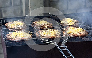 Meet with cheese on grill. B-B-Q