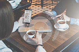 Meet one-on-one.Woman looking on graphs,charts and diagrams on smartphone screen.