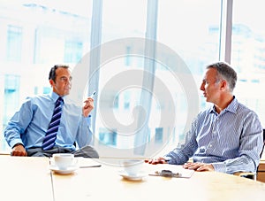 Meeting, discussion and business men in office for management conversation, talking and planning. Corporate workers