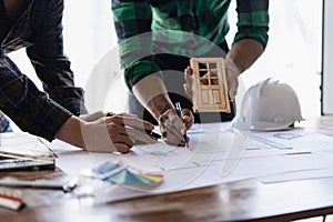 Meeting of engineers or architects shaking hands for project Work with partners