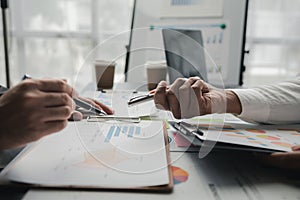 In a meeting between the finance and marketing departments to discuss work plans, two startup employees are brainstorming ideas