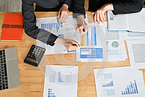 Meeting of financial, Two business working with finance paper and calculator with top view