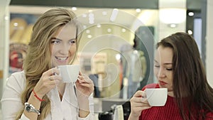 Meeting of girlfriends over a cup of coffe. Fun conversation, laughter, smile