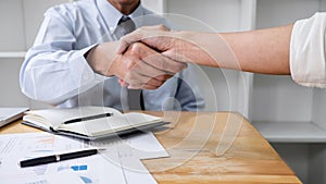 Meeting and greeting concept, Two collaboration business handshake and business people after discussing good deal of contract and