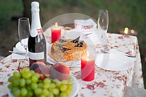 A meeting of lovers, a romantic candlelit dinner and a glass of champagne with sweets