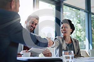 Meeting, partnership and business people shaking hands in the office for a deal, collaboration or onboarding. Diversity