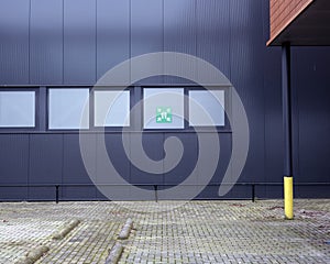 Meeting point sign in industrial environment
