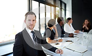 Meeting, portrait and businessman in conference room with business people, confidence and leadership. Boardroom, men and