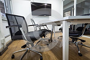 Meeting table and black chairs in meeting room