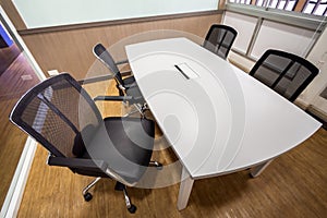 Meeting table and black chairs in meeting room