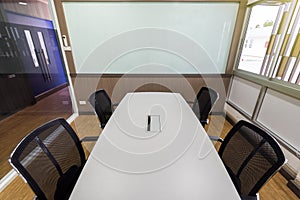 Meeting table and black chairs in meeting room