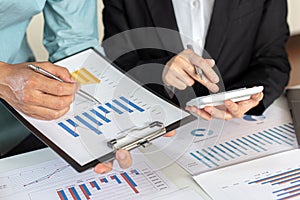 Meeting a team of businessmen, Executives and accountants meeting about the company`s revenue graph in the office with laptops an