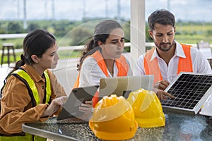 Meeting team technician solar cell meeting brainstorm. Engineer working research project set up solar cell panel renewable at