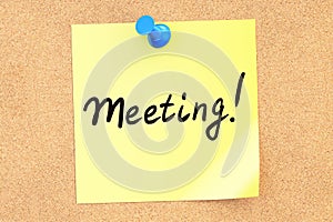 Meeting! Text on a sticky note pinned to a corkboard. 3D rendering