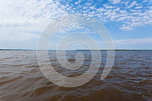 Meeting of Waters. Brazilian rivers confluence from Manaus photo