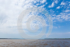 Meeting of Waters. Brazilian rivers confluence from Manaus photo