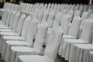 Meeting white chair in seminar emtry people