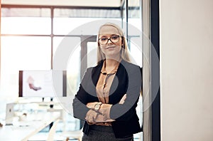 The meeting will commence in five minutes. a confident young businesswoman working in a modern office.