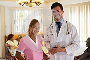 Meeting At Work With Doctor And Nurse In Hospice