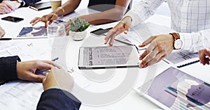 Meetings can only increase the chances of success. Cropped shot of a group of businesspeople sitting around the