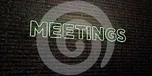 MEETINGS -Realistic Neon Sign on Brick Wall background - 3D rendered royalty free stock image