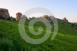 The megalith granite on the alpine meadow sunset