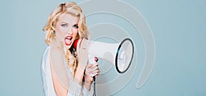 Megaphone and women. Portrait of pinup girl shouting. Young excited blonde fun woman screaming hot news, shouting aside