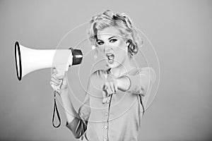 Megaphone and women. Portrait of pinup girl shouting. Young excited blonde woman screaming hot news, shouting in