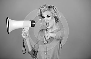 Megaphone and women. Portrait of pinup girl shouting. Young excited blonde woman screaming hot news, shouting in