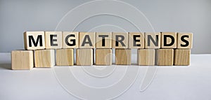 Megatrends symbol. The word megatrends on wooden cubes. Beautiful white background. Business and megatrends concept. Copy space