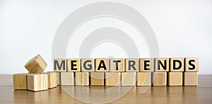 Megatrends symbol. The word megatrends on wooden cubes. Beautiful wooden table, white background. Business and megatrends concept